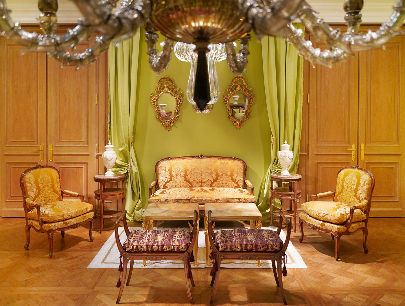 Louis XV sofa, French Empire table, Louis XV armchair, brass coffee table onix top, venetian mirror, venetian chandeliere, classical oak boiserie | P.& G. Cugini Lanzani